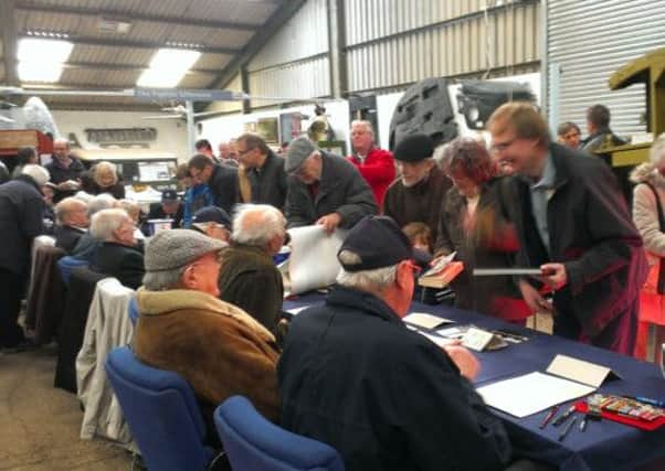 Bomber Command veterans sign ing at Wings Museum, Balcombe