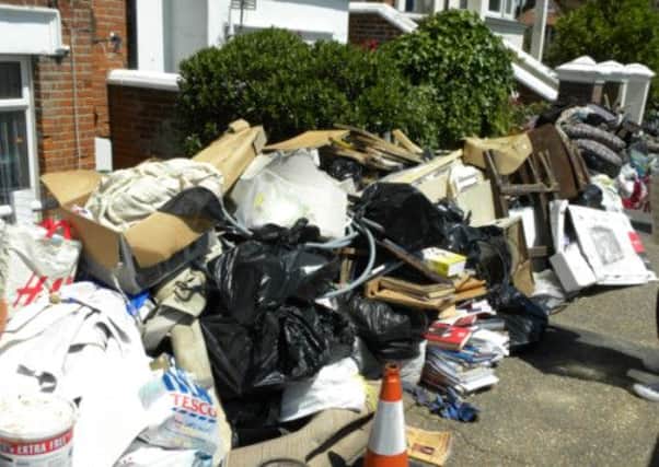 Ruined possessions thrown out in South Terrace following June's devastating floods, in Littlehampton