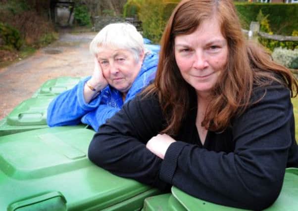 JPCT 100413 S13160045x Storrington. Nikki Turner (front) with neighbour Mary Gattrell fed up with irratic rubbish collections -photo by Steve Cobb