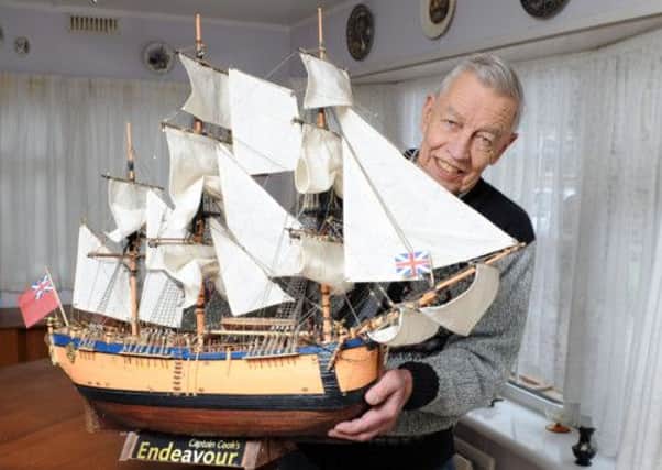 Al Hamson 85, who has just completed  two years of making a model of HMS Endeavour from a magazine    PHOTO: Liz Pearce L15354H13