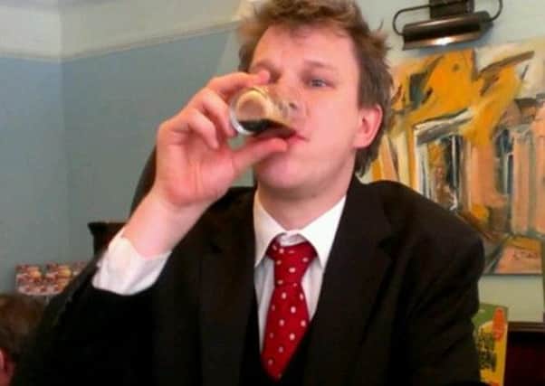County Times news editor Theo Cronin enjoying the exotic ale