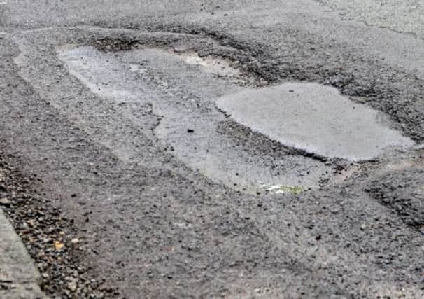 JPCT 120413 Potholes in Keymer Road, Hasocks. Photo by Derek Martin