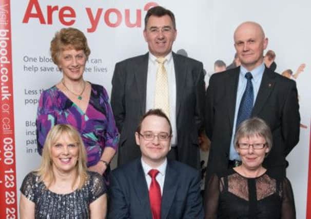 Back, left to right, Mary Coy, Richard Fryett,  and  Roger Gentle, 
Front, left to right,  Elizabeth Harris,  Darren Bowen, regional donor contact manager for NHS Blood and Transplant, 100th award recipient  Susan Rixon, of Rustington