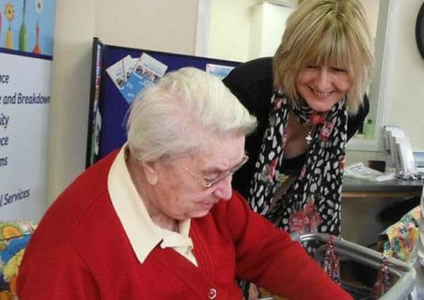 Henfield customer, Agnes Black, gets involved in art therapy with Karen Pirks, assistant manager at the centre.