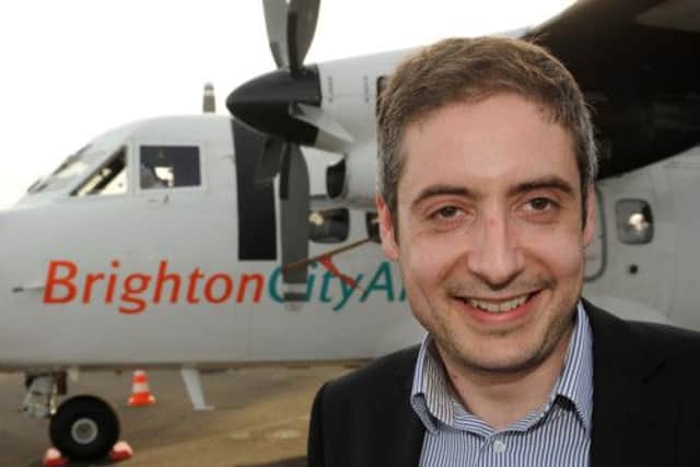 W17601H13 Jonathan Candelon, director of Brighton City Airways, outside the Let 410 commuter aircraft