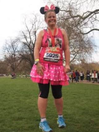Helen Minnie Mouse Pratt (BHR) at the finish of the London Marathon start at Blackheath