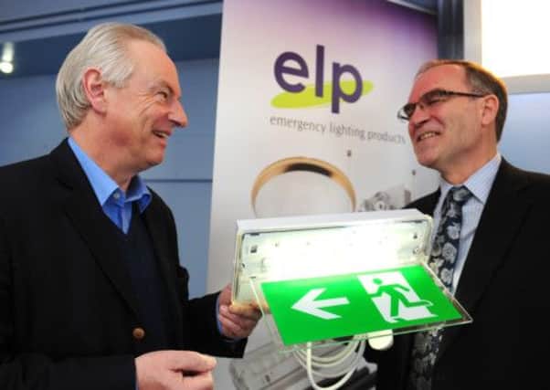 JPCT 190413 Francis Maude talking to managing director David Wright on his visit to ELP Emergency Lighting Products Ltd. Photo by Derek Martin