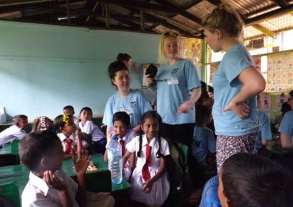 Students from The Littlehampton Academy helping with pupils at a Sri Lankan primary school