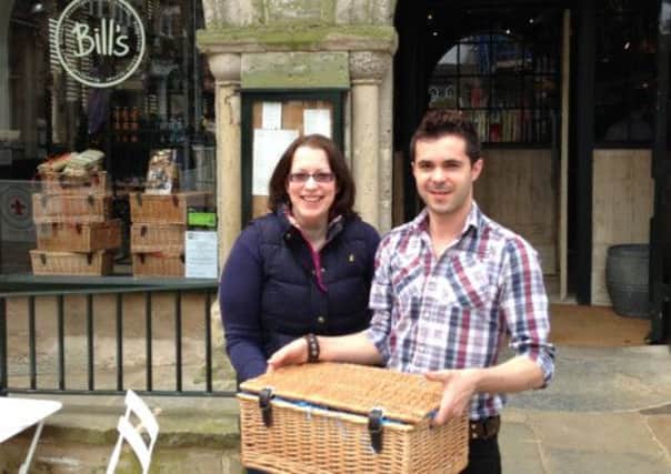 Claire from Horsham, Piazza Italia public survey winner of the Bill's elderflower hamper with Bill's manager Pedro Martin - picture submitted