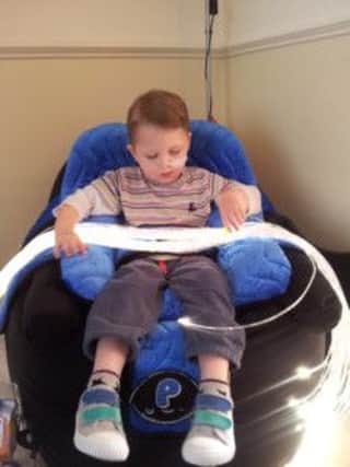 Matty Van den Dyck in his new chair which was paid for by the Arundel Rotary Club.