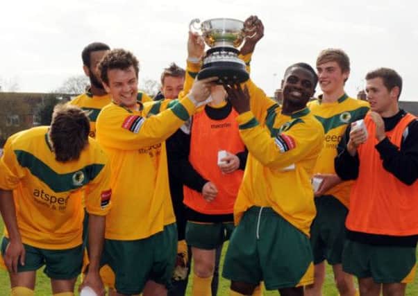 Horsham players celebrate winning the Brighton Charity Cup