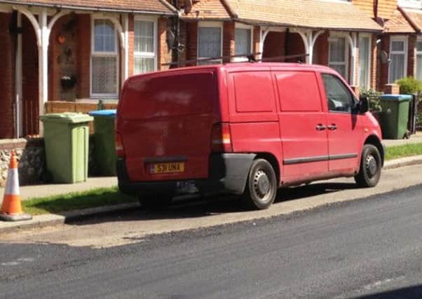 Contractors resurfacing the road left this van with its own patch of the old Tarmac in Selborne Road, Littlehampton