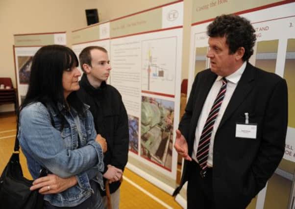 JPCT 220612  Public exhibition on Celtique's plans to drill for gas south of Billingshurst. Geoff Davies from Celtique right, talking to Lorraine Dale and Martin Dale. Photo by Derek Martin