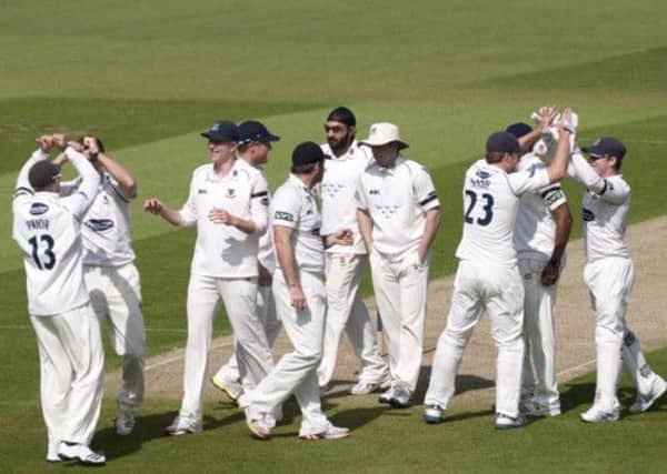 Sussex celebrate during their match against Surrey at the Oval. The players worn black armband in memory of Craig Botting