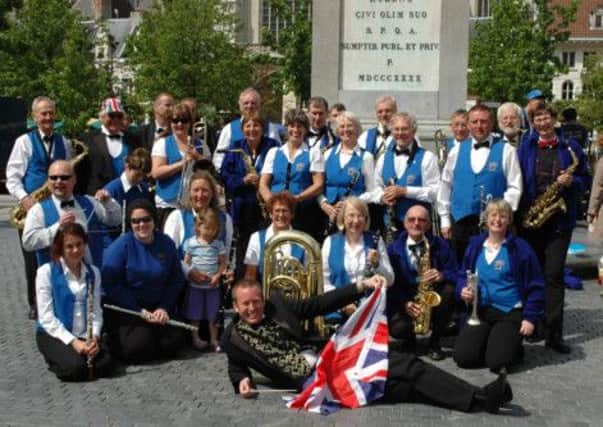 Members of Littlehampton Concert Band take a breather during their performance in Antwerp.