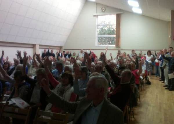Mannings Heath residents pack out the village hall to hear the latest from the village action group, formed to fight housing proposals (JJP).
