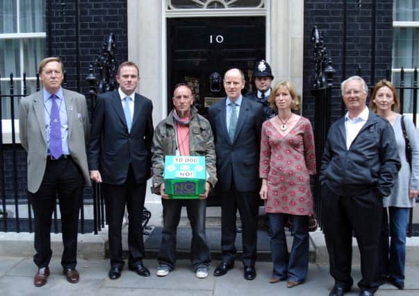 A delegation from Communities Against Ford Eco-Town (CAFE) went to Number 10 Downing Street yesterday (2 October) to deliver a petition signed by 10,000 people.

 

They were joined by West Sussex MPs Nick Herbert (Arundel & South Downs) and Nick Gibb (Bognor Regis & Littlehampton).