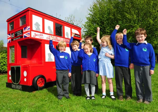 Amberley school gets a red London bus. Photo by Derek Martin