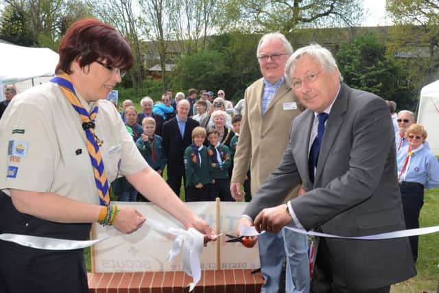 C130653-1 Bog May16 Scouts  phot kate

Colin Field County Chairman cuts the ribon to open the new scout headquarters in North Bersted with Alison McCaffrey, Disrict Commissioner for Bognor Regis with Richard Beckett, chairman of Bognor Regis District Scout Council.Picture by Kate Shemilt.C130653-1