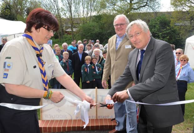 C130653-1 Bog May16 Scouts  phot kate

Colin Field County Chairman cuts the ribon to open the new scout headquarters in North Bersted with Alison McCaffrey, Disrict Commissioner for Bognor Regis with Richard Beckett, chairman of Bognor Regis District Scout Council.Picture by Kate Shemilt.C130653-1
