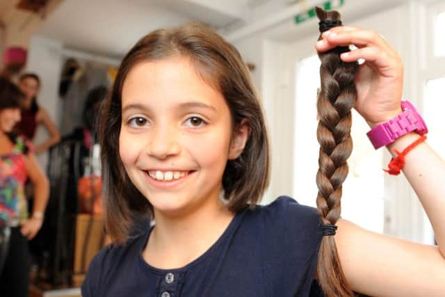 JPCT 100513 S132000375x Nine-year-old Daisy donating her hair for charity -photo by Steve Cobb