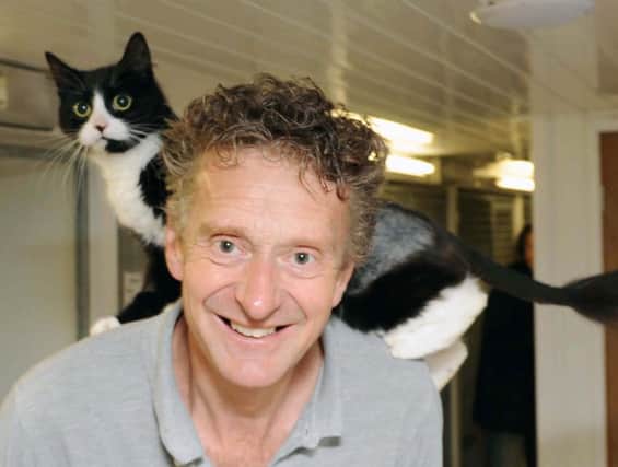 Senior animal rescue officer Billy Elliott with a cat needing a home