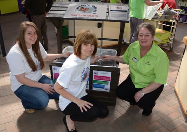 From left Jamie Elle Bray and Tracy Terry, of Jamies Wish, with garden centre assistant general manager Mary Corcoran and the wishing well.