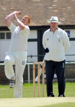 Andrew Williams bowls for Bexhill in last weekend's two-wicket win over St James's Montefiore. Picture by Steve Hunnisett (eh20015c)