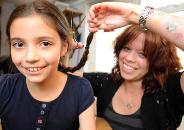 JPCT 100513 S132000355x Nine-year-old Daisy donating her hair for charity -photo by Steve Cobb