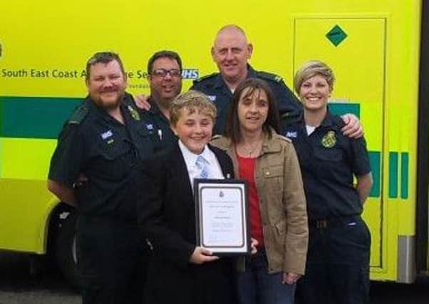 George Davey, 12, of Wick, is hailed for his heroics in saving his mum Kerri, by ambulance staff in Littlehampton
