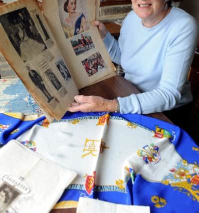 C130665-2 Bog May16 Headlines Queen  phot kate

Carol Andrews with some of her memorabilia from the Coronation.Picture by Kate Shemilt.C130665-2