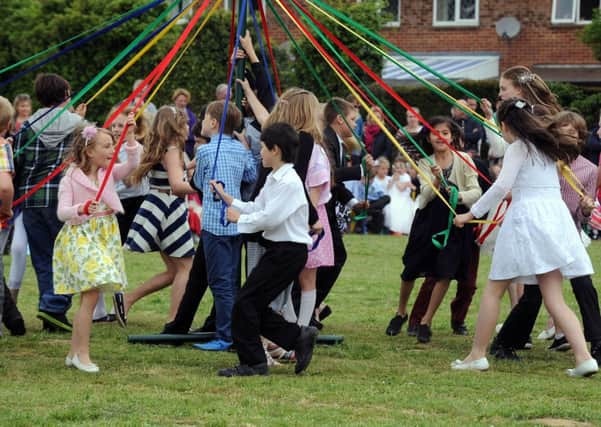 Children from St Wilfreds Catholic School maypole dancing. L22049H13