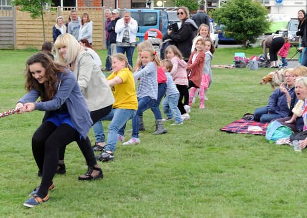 All pulling together. . . tug-of-war at the Party on the Green during last years festival