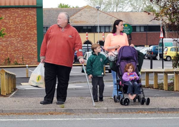 Mike Northeast attempts to cross the A259 with Tracey Rowbotham and her children Jacob, six, and May, two