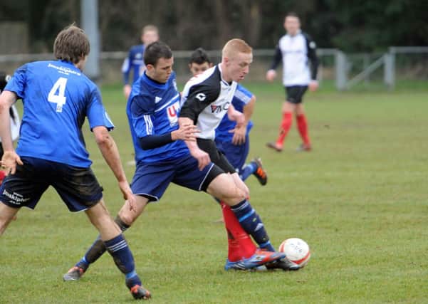 Action from Horsham YMCA v Sidley last season. Cash-straped Sidley are currently fighting for their survival