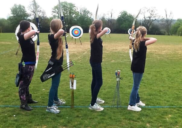 Some of the archers in the women's squad in action