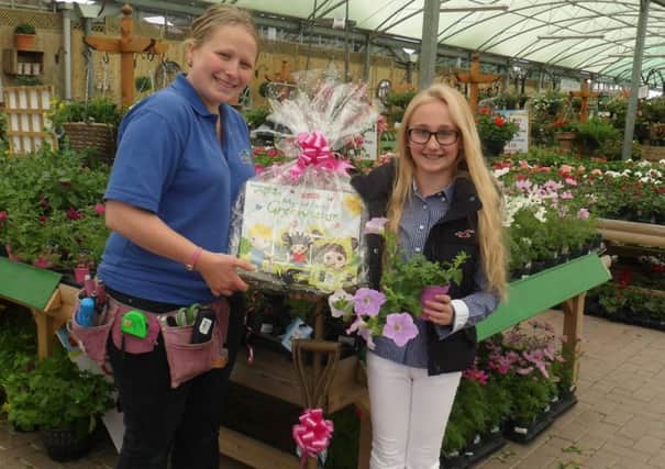 Katie Wardell of Newbridge Nurseries presenting Georgia Garmen with her prizes. Picture submitted.