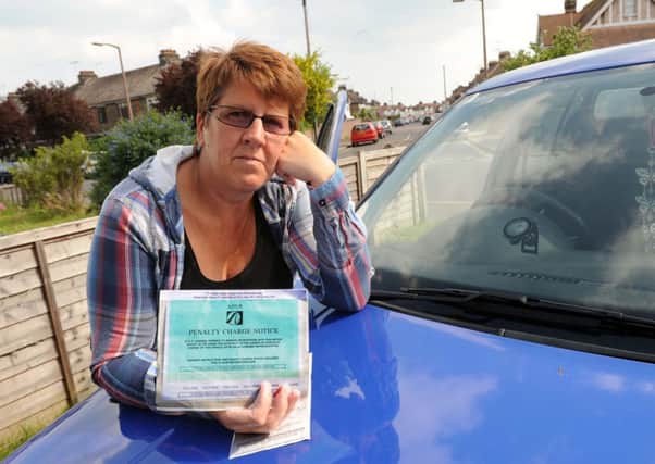 S23657H13

Parking Fine in Beach Green Shoreham. Midwife Theresa Smytherman with parking tickets