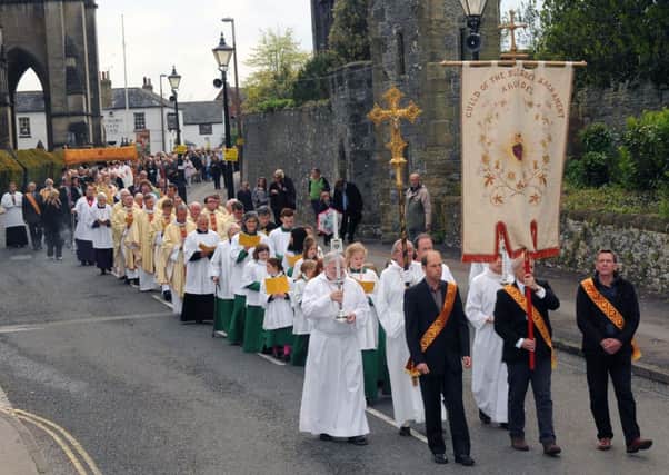 The Corpus Christi procession makes its way from the cathedral to the castle L23554H13