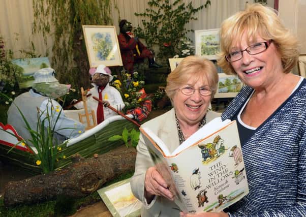 Val Adams (left) and Sue Seath with their floral Wind in the Willows scene L23728H13