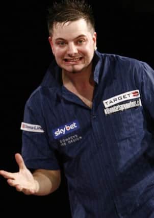 Adrian Gray is through to round three of the Speedy Services UK Darts Open