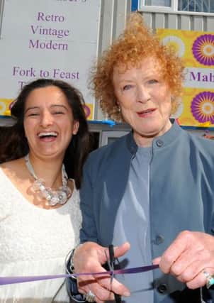 JPCT 080613 Call the Midwife star Judy Parfitt right, opens Miss Mabel, Victoria Way, Burgess Hill, with owner Emma Haward. Photo by Derek Martin