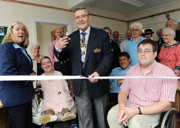 Littlehampton Rotary Club president Geoff Watts cuts the ribbon   L24213H13