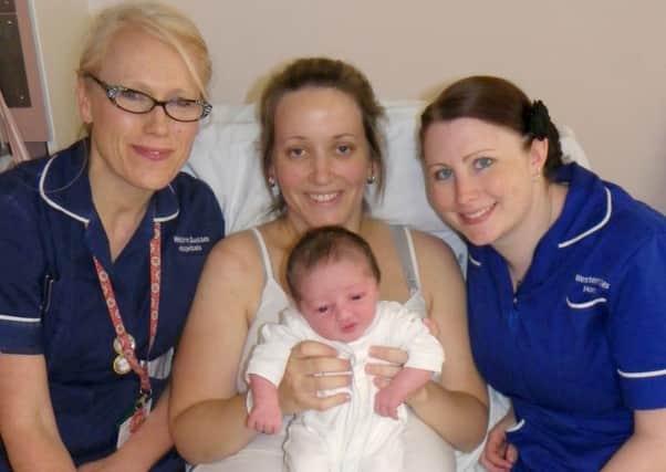 Ward manager Juliette Phelan, left, and deputy ward manager Kat Turner celebrate with mum Rachel Russell and baby Gracie at Worthing Hospital