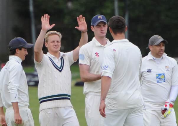 Gotcha! Chichester celebrate a wicket, but (below) Dan Smith's late unbeaten 50 was crucial for Roffey. Pictures Derek Martin