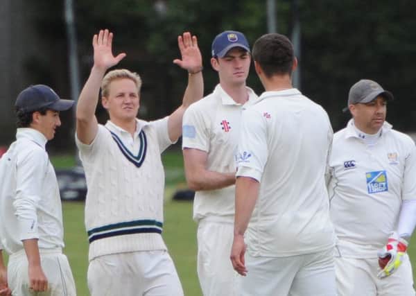 Chichester celebrate after Richard Browning (back to camera) takes a wicket at Roffey  Picture by Derek Martin