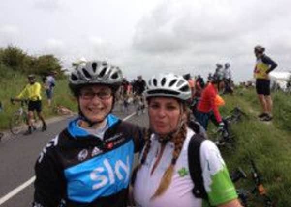 Sophie en route at this year's London to Brighton bike ride with friend Jaime Carter (left)