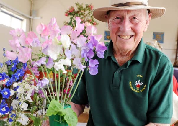 L25096H13-RoseShowEPreston

Rose Show. East Preston and Kington Horticultural Society Rose Show. Pictured is Patrick Simms with his Sweet Peas.  Conservative Hall, East Preston.