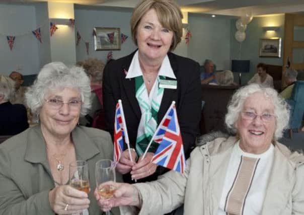 Residents celebrating the 60th anniversary of the Queens coronation