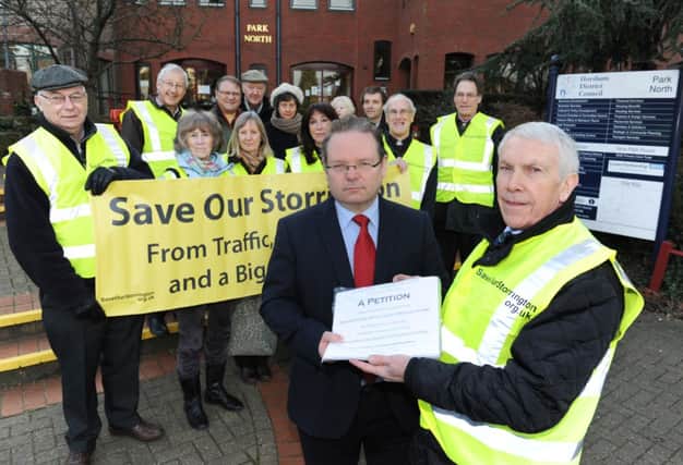 JPCT-17-01-12 S12030658a Save our Storrington presenting their petition against Waitrose expanision to HDC planners. Horsham District Council offices, Park North, North Street, Horsham, RH12 1RL. Rod Brown, Head of Planning Environmental Services, receives petition from Peter Westrip -photo by steve cobb